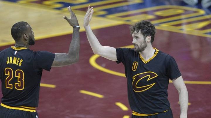 Apr 3, 2016; Cleveland, OH, USA; Cleveland Cavaliers forward LeBron James (23) and forward Kevin Love (0) celebrate in the fourth quarter against the Charlotte Hornets at Quicken Loans Arena. Mandatory Credit: David Richard-USA TODAY Sports