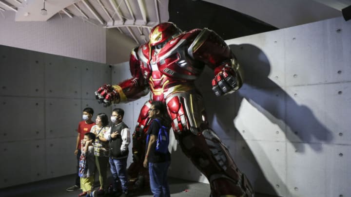 JAKARTA, JUNE 15 : Visitors take pictures with the Iron Man Hulkbuster costumes on display during Marvel Studios Exhibition in Jakarta, Indonesia on June 15, 2022. The exhibition is claimed by the organizers to be the largest in Southeast Asia, featuring a complete collection of original movie props, costumes, and concept art from Marvel films. (Photo by Agoes Rudianto/Anadolu Agency via Getty Images)
