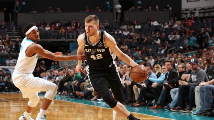 CHARLOTTE, NC - MARCH 26: Davis Bertans #42 of the San Antonio Spurs handles the ball against the Charlotte Hornets on March 26, 2019 at the Spectrum Center in Charlotte, North Carolina. NOTE TO USER: User expressly acknowledges and agrees that, by downloading and/or using this photograph, user is consenting to the terms and conditions of the Getty Images License Agreement. Mandatory Copyright Notice: Copyright 2019 NBAE (Photo by Kent Smith/NBAE via Getty Images)