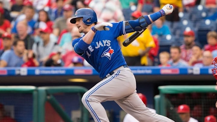 Jun 16, 2016; Philadelphia, PA, USA; Toronto Blue Jays third baseman Josh Donaldson (20) hits a single during the first inning against the Philadelphia Phillies at Citizens Bank Park. Mandatory Credit: Bill Streicher-USA TODAY Sports