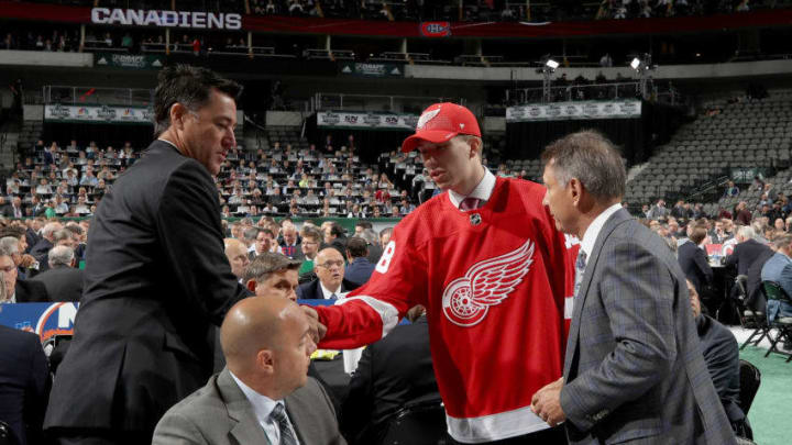 DALLAS, TX - JUNE 23: Jared McIsaac reacts after being selected 36th overall by the Detroit Red Wings during the 2018 NHL Draft at American Airlines Center on June 23, 2018 in Dallas, Texas. (Photo by Bruce Bennett/Getty Images)