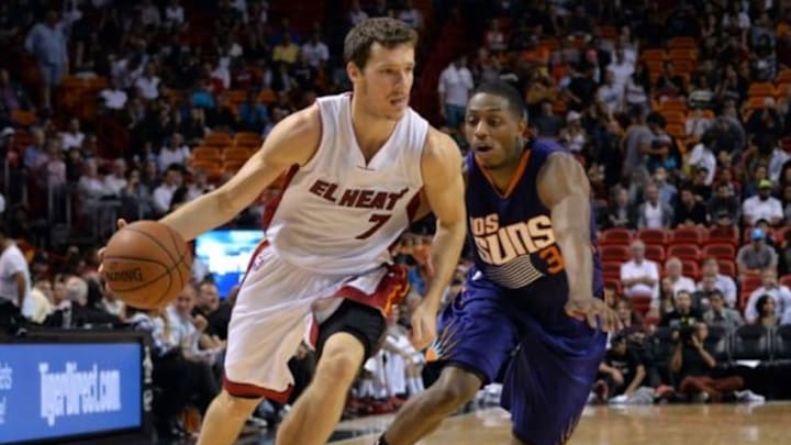 Mar 2, 2015; Miami, FL, USA; Miami Heat guard Goran Dragic (7) dribbles past Phoenix Suns guard Brandon Knight (3) during the second half at American Airlines Arena. Mandatory Credit: Steve Mitchell-USA TODAY Sports