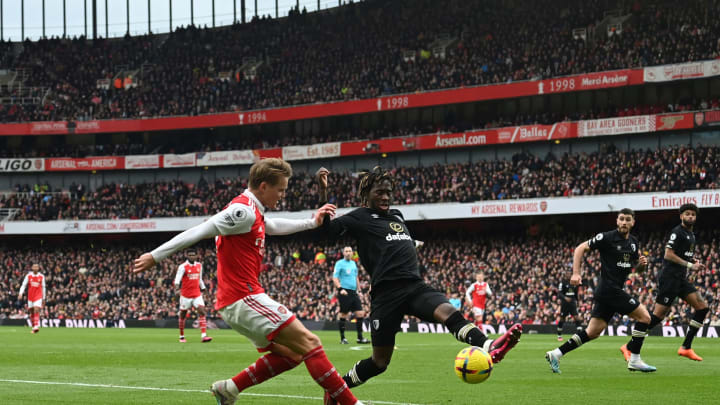 Arsenal’s Norwegian midfielder Martin Odegaard (L) fights for the ball with Bournemouth’s English defender Jordan Zemura during the English Premier League football match between Arsenal and Bournemouth at the Emirates Stadium in London on March 4, 2023. (Photo by Glyn KIRK / AFP) / RESTRICTED TO EDITORIAL USE. No use with unauthorized audio, video, data, fixture lists, club/league logos or ‘live’ services. Online in-match use limited to 120 images. An additional 40 images may be used in extra time. No video emulation. Social media in-match use limited to 120 images. An additional 40 images may be used in extra time. No use in betting publications, games or single club/league/player publications. / (Photo by GLYN KIRK/AFP via Getty Images)