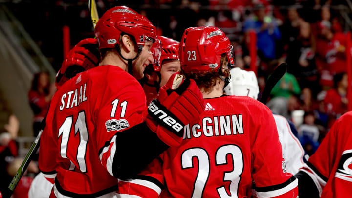 RALEIGH, NC – DECEMBER 16: Jordan Staal #11 of the Carolina Hurricanes scores a goal and celebrates with teammate Brock McGinn #23 during an NHL game against the Columbus Blue Jackets on December 16, 2017 at PNC Arena in Raleigh, North Carolina. (Photo by Gregg Forwerck/NHLI via Getty Images)