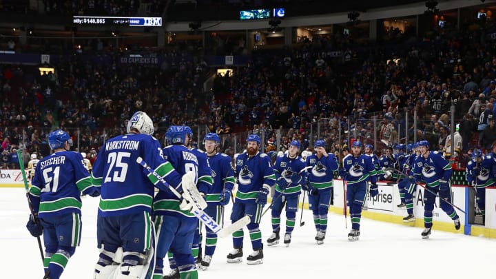 Jacob Markstrom #25 of the Vancouver Canucks and his teammates (Photo by Jeff Vinnick/NHLI via Getty Images)