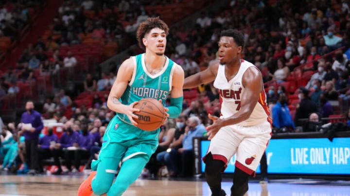 MIAMI, FLORIDA - OCTOBER 11: LaMelo Ball #2 of the Charlotte Hornets controls the ball against Kyle Lowry #7 of the Miami Heat during the preseason game at FTX Arena on October 11, 2021 in Miami, Florida. NOTE TO USER: User expressly acknowledges and agrees that, by downloading and/or using this Photograph, user is consenting to the terms and conditions of the Getty Images License Agreement. (Photo by Mark Brown/Getty Images)