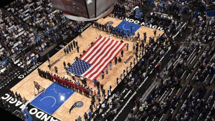 ORLANDO, FL - OCTOBER 26: The Orlando Magic and Miami Heat during a ceremony including a moment of silence for the victims of the Pulse Nightclub shooting victims before the home opener on October 26, 2016 at Amway Center in Orlando, Florida. NOTE TO USER: User expressly acknowledges and agrees that, by downloading and or using this photograph, User is consenting to the terms and conditions of the Getty Images License Agreement. Mandatory Copyright Notice: Copyright 2016 NBAE (Photo by Gary Bassing/NBAE via Getty Images)