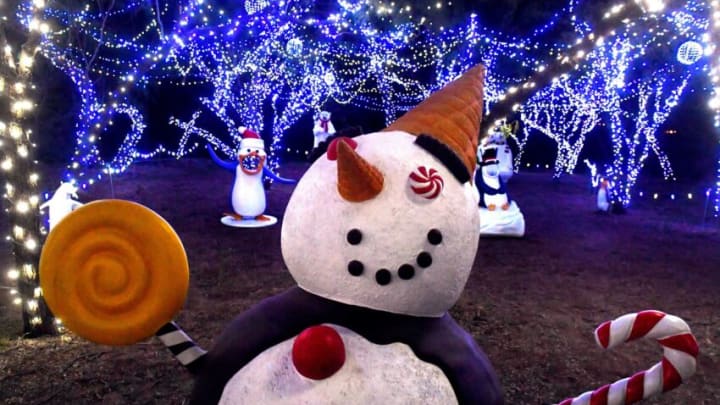 A confectionary snowman greets visitors within the United Way's Winter Lightfest Sunday. Nov. 20, 2022. The holiday tradition on E.N. 10th Street, east of Taylor Elementary School features a mile-long lighted walking trail and kicks off for the public Friday evening.