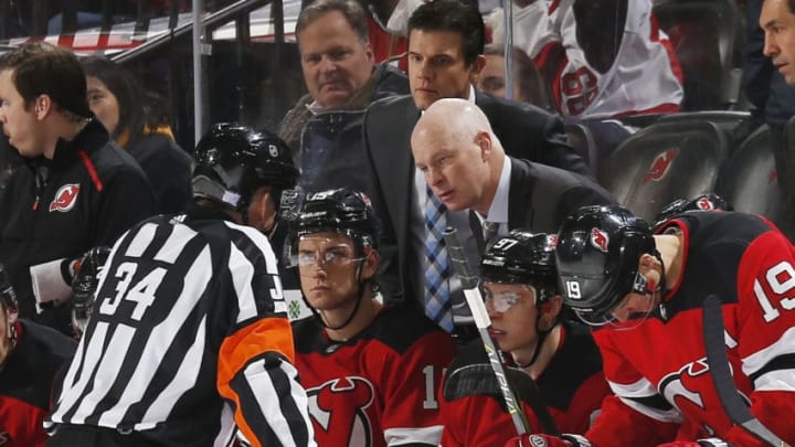 NEWARK, NJ - NOVEMBER 26: Head Coach of the New Jersey Devils John Hynes chats with Referee Brad Meier #34 during the game against the Minnesota Wild at the Prudential Center on November 26, 2019 in Newark, New Jersey. (Photo by Andy Marlin/NHLI via Getty Images)