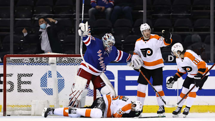 Apr 22, 2021; New York, New York, USA; Igor Shesterkin #31 of the New York Rangers signals for help after James van Riemsdyk #25 of the Philadelphia Flyers falls to the ice as teammates Joel Farabee #86 and Travis Konecny #11 of the Philadelphia Flyers stand by in the second period at Madison Square Garden. Riemsdyk was credited with the goal after it went into the net off of his face, Mandatory Credit: Elsa/POOL PHOTOS-USA TODAY Sports