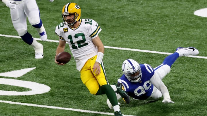 INDIANAPOLIS, INDIANA - NOVEMBER 22: Aaron Rodgers #12 of the Green Bay Packers rushes the ball past DeForest Buckner #99 of the Indianapolis Colts during the second quarter in the game at Lucas Oil Stadium on November 22, 2020 in Indianapolis, Indiana. (Photo by Andy Lyons/Getty Images)