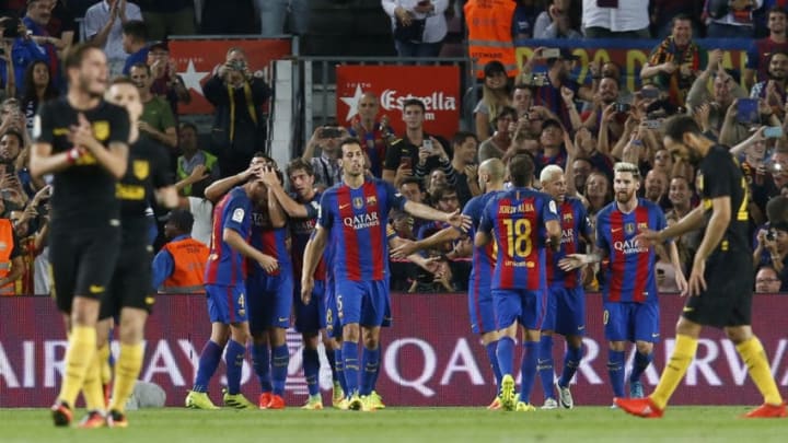 Barcelona's players celebrate a goal during the Spanish league football match FC Barcelona vs Atletico de Madrid at the Camp Nou stadium in Barcelona on September 21, 2016. / AFP / PAU BARRENA (Photo credit should read PAU BARRENA/AFP/Getty Images)
