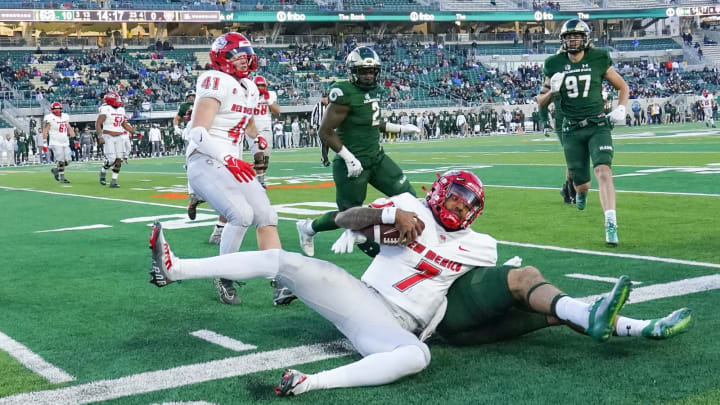 Nov 25, 2022; Fort Collins, Colorado, USA; New Mexico Lobos quarterback CJ Montes (7) pushed out of bounds for a loss of yardage at Sonny Lubick Field at Canvas Stadium. Mandatory Credit: Michael Madrid-USA TODAY Sports
