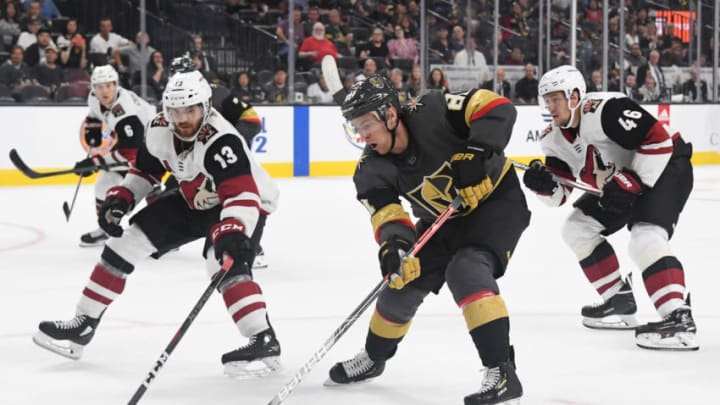 LAS VEGAS, NEVADA - SEPTEMBER 15: Jonathan Marchessault #81 of the Vegas Golden Knights skates with the puck against Vinnie Hinostroza #13 of the Arizona Coyotes in the second period of their preseason game at T-Mobile Arena on September 15, 2019 in Las Vegas, Nevada. The Golden Knights defeated the Coyotes 6-2. (Photo by Ethan Miller/Getty Images)
