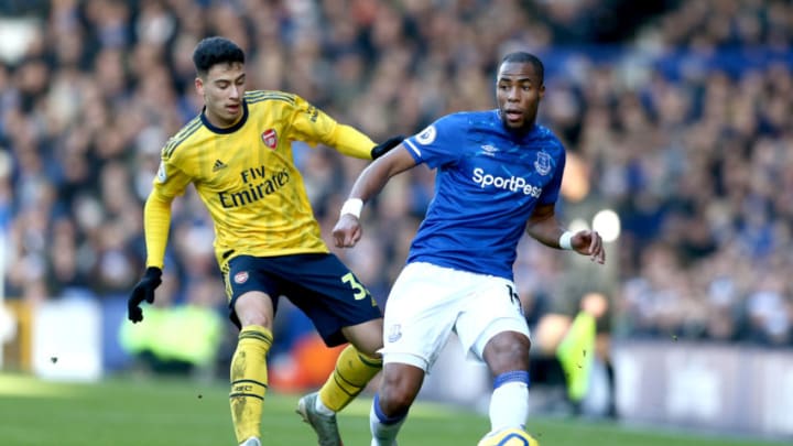 LIVERPOOL, ENGLAND - DECEMBER 21: Djibril Sidibe of Everton battles for possession with Gabriel Martinelli of Arsenal during the Premier League match between Everton FC and Arsenal FC at Goodison Park on December 21, 2019 in Liverpool, United Kingdom. (Photo by Jan Kruger/Getty Images)