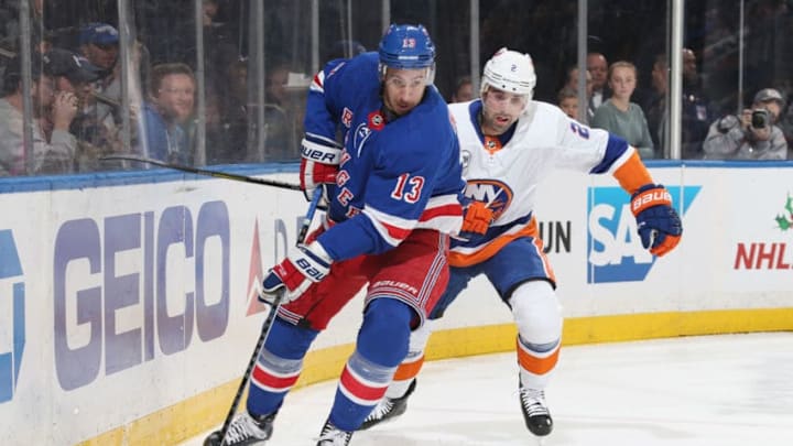 NEW YORK, NY - NOVEMBER 21: Kevin Hayes #13 of the New York Rangers skates with the puck against Nick Leddy #2 of the New York Islanders at Madison Square Garden on November 21, 2018 in New York City. The New York Rangers won 5-0. (Photo by Jared Silber/NHLI via Getty Images)