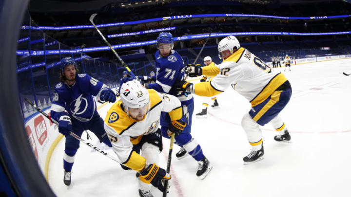 Feb 1, 2021; Tampa, Florida, USA;Nashville Predators right wing Viktor Arvidsson (33) skates with the puck as Tampa Bay Lightning defenseman Mikhail Sergachev (98) and Tampa Bay Lightning center Anthony Cirelli (71) defend during the second period at Amalie Arena. Mandatory Credit: Kim Klement-USA TODAY Sports