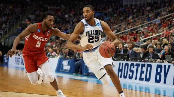 PITTSBURGH, PA - MARCH 15: Villanova Wildcats guard Mikal Bridges (25) tries to drive around Radford Highlanders guard Donald Hicks (5) during the second half of the first round of the NCAA Division I Men's Championships between the Villanova Wildcats and the Radford Highlanders at PPG Paints Arena in Pittsburgh, PA on March 15, 2018. (Photo by Shelley Lipton/Icon Sportswire via Getty Images)