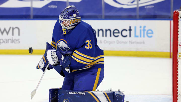 Apr 8, 2021; Buffalo, New York, USA; Buffalo Sabres goaltender Linus Ullmark (35) makes a save during the third period against the New Jersey Devils at KeyBank Center. Mandatory Credit: Timothy T. Ludwig-USA TODAY Sports