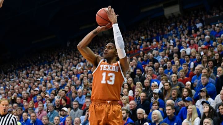 LAWRENCE, KANSAS - JANUARY 14: Jase Febres #13 of the Texas Longhorns shoos against the Kansas Jayhawks at Allen Fieldhouse on January 14, 2019 in Lawrence, Kansas. (Photo by Ed Zurga/Getty Images)