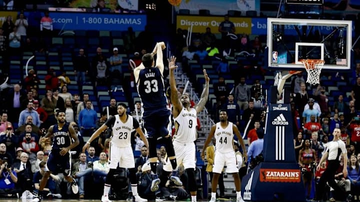 Dec 5, 2016; New Orleans, LA, USA; Memphis Grizzlies center Marc Gasol (33) shoots a three pointer over New Orleans Pelicans forward Terrence Jones (9) in the final seconds of the fourth quarter of a game at the Smoothie King Center. The Grizzlies defeated the Pelicans 110-108 in double overtime. Mandatory Credit: Derick E. Hingle-USA TODAY Sports