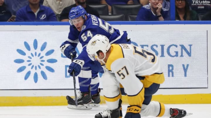 TAMPA, FL - SEPTEMBER 20: Tampa Bay Lightning forward Carter Verhaeghe (54) is defended by Nashville Predators defenseman Dante Fabbro (57) during the NHL Preseason game between the Nashville Predators and Tampa Bay Lightning on September 20, 2019 at Amalie Arena in Tampa, FL. (Photo by Mark LoMoglio/Icon Sportswire via Getty Images)