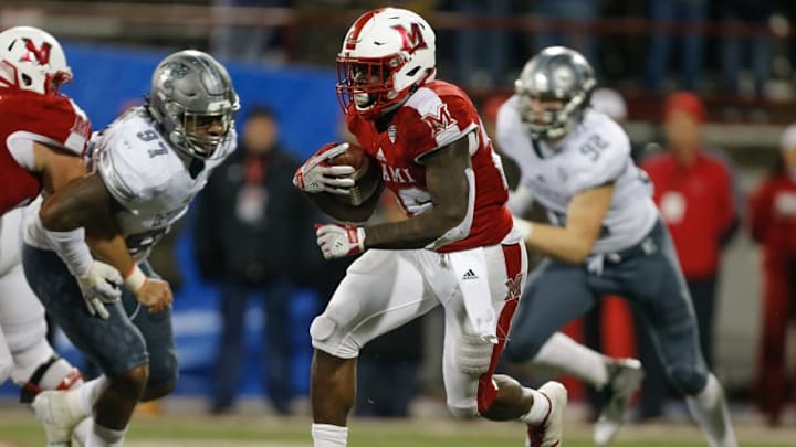 OXFORD, OH - NOVEMBER 15: Alonzo Smith #26 of the Miami Ohio Redhawks runs with the ball against the Eastern Michigan Eagles during the second half at Yager Stadium on November 15, 2017 in Oxford, Ohio. (Photo by Michael Reaves/Getty Images)