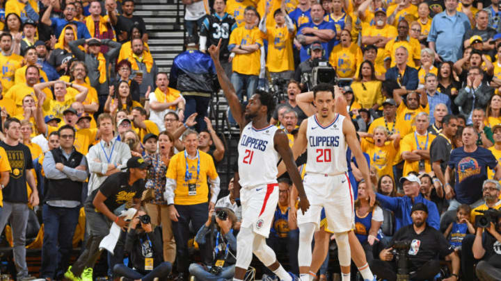 OAKLAND, CA - APRIL 24: Patrick Beverley #21 of the LA Clippers celebrates during the game against the Golden State Warriors during Game Five of Round One of the 2019 NBA Playoffs on April 24, 2019 at ORACLE Arena in Oakland, California. NOTE TO USER: User expressly acknowledges and agrees that, by downloading and or using this photograph, user is consenting to the terms and conditions of Getty Images License Agreement. Mandatory Copyright Notice: Copyright 2019 NBAE (Photo by Andrew D. Bernstein/NBAE via Getty Images)