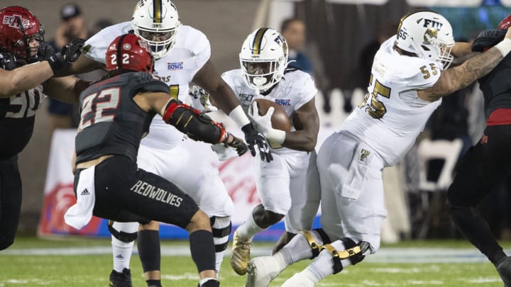 MONTGOMERY, AL – DECEMBER 21: Running back Anthony Jones #2 of the FIU Golden Panthers runs the ball through traffic during their game against the Arkansas State Red Wolves during the Camellia Bowl at the Crampton Bowl on December 21, 2019, in Montgomery, Alabama. (Photo by Michael Chang/Getty Images)