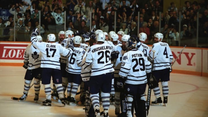 TORONTO, ON - MAY 16: The Toronto Maple Leafs celebrate against the Vancouver Canucks during 1993-1994 NHL playoff game action at Maple Leaf Gardens in Toronto, Ontario, Canada. (Photo by Graig Abel/Getty Images)