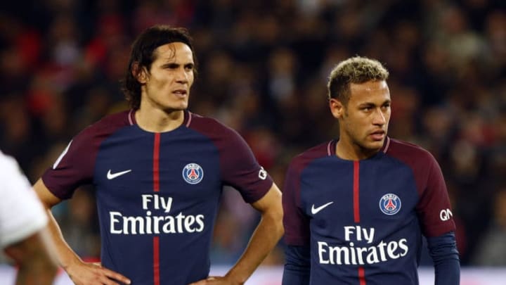 Paris Saint-Germain's Uruguayan forward Edinson Cavani (L) and Paris Saint-Germain's Brazilian forward Neymar react during the French Ligue 1 football match between Paris Saint-Germain (PSG) and Lyon (OL) on September 17, 2017 at the Parc des Princes stadium in Paris. (Photo by Mehdi Taamallah/NurPhoto via Getty Images)