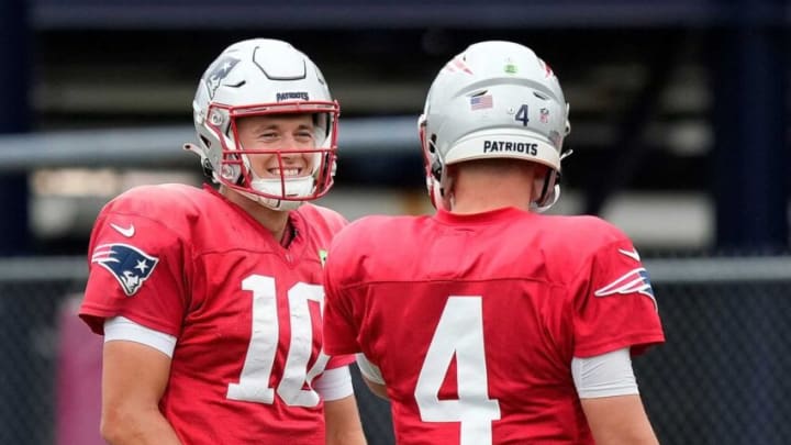 Patriot QBÕs #10 Mack Jones and #4 Bailey Zappe share a laugh at practice today.CP 1