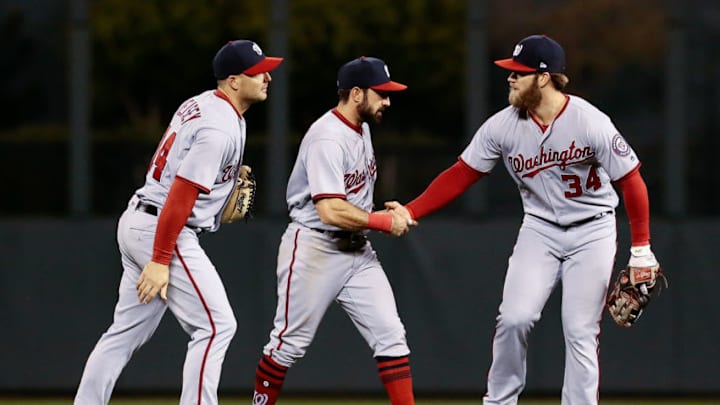 Apr 25, 2017; Denver, CO, USA; Washington Nationals left fielder Chris Heisey (14) and center fielder Adam Eaton (2) and right fielder Bryce Harper (34) celebrate after the game against the Colorado Rockies at Coors Field. Mandatory Credit: Isaiah J. Downing-USA TODAY Sports