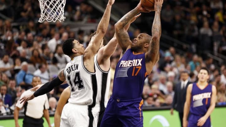 Dec 28, 2016; San Antonio, TX, USA; Phoenix Suns small forward P.J. Tucker (17) shoots the ball as San Antonio Spurs shooting guard Danny Green (14) and Pau Gasol (16, behind) defends during the first half at AT&T Center. Mandatory Credit: Soobum Im-USA TODAY Sports