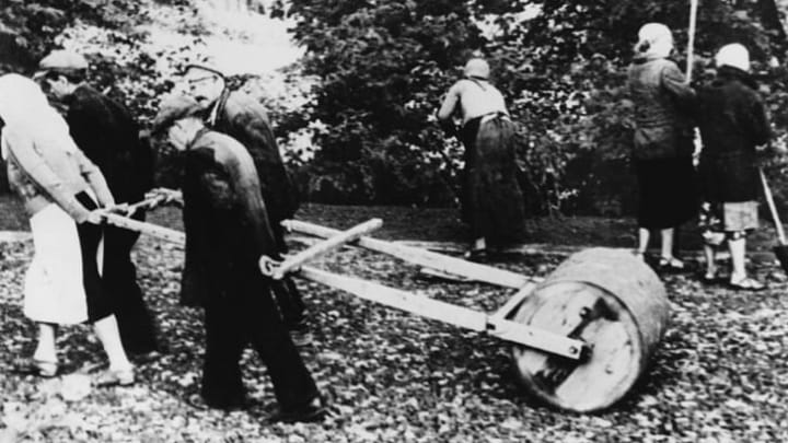 Jewish civilians repair road damage in March 1941. The fake epidemic saved thousands of ethnic Poles from such forced labor.