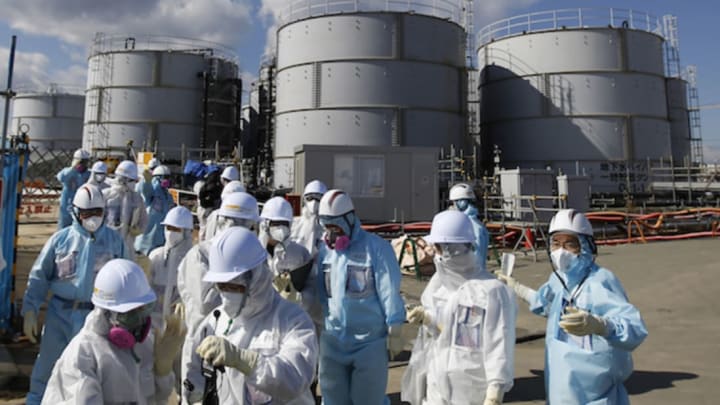 TEPCO workers at the Fukushima plant // Getty Images