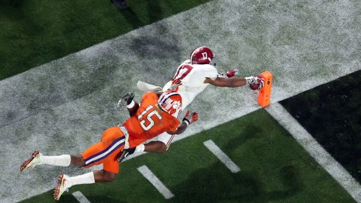Jan 11, 2016; Glendale, AZ, USA; Alabama Crimson Tide running back Kenyan Drake (17) dives for a touchdown on a 95 yard kick off return defended by Clemson Tigers safety T.J. Green (15) during the fourth quarter in the 2016 CFP National Championship at University of Phoenix Stadium. Mandatory Credit: Erich Schlegel-USA TODAY Sports