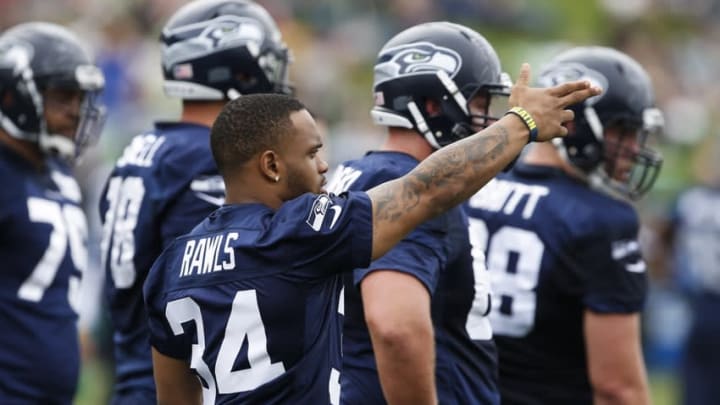 Jul 30, 2016; Renton, WA, USA; Seattle Seahawks running back Thomas Rawls (34) watches a drill during training camp at the Virginia Mason Athletic Center. Mandatory Credit: Joe Nicholson-USA TODAY Sports