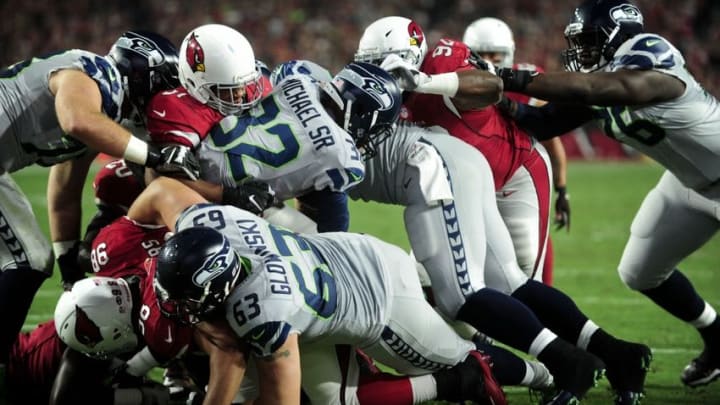 Oct 23, 2016; Glendale, AZ, USA; Seattle Seahawks running back Christine Michael (32) is tackled on the goal line during the first half against the Arizona Cardinals at University of Phoenix Stadium. Mandatory Credit: Matt Kartozian-USA TODAY Sports