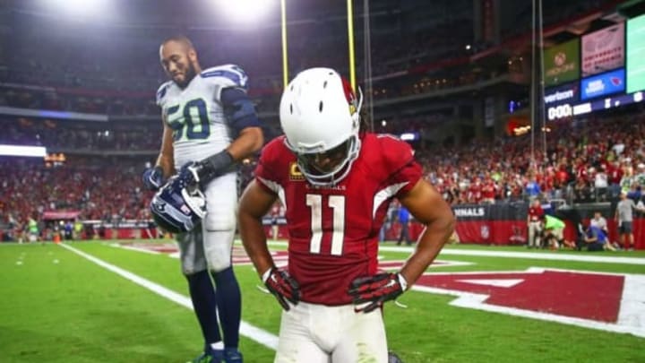 Oct 23, 2016; Glendale, AZ, USA; Arizona Cardinals wide receiver Larry Fitzgerald (11) and Seattle Seahawks linebacker K.J. Wright (50) react following the game at University of Phoenix Stadium. The game ended in a 6-6 tie after overtime. Mandatory Credit: Mark J. Rebilas-USA TODAY Sports