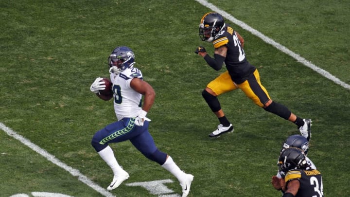 PITTSBURGH, PA - SEPTEMBER 15: Rashaad Penny #20 of the Seattle Seahawks rushes for a 37-yard touchdown in the third quarter against the Pittsburgh Steelers on September 15, 2019 at Heinz Field in Pittsburgh, Pennsylvania. (Photo by Justin K. Aller/Getty Images)