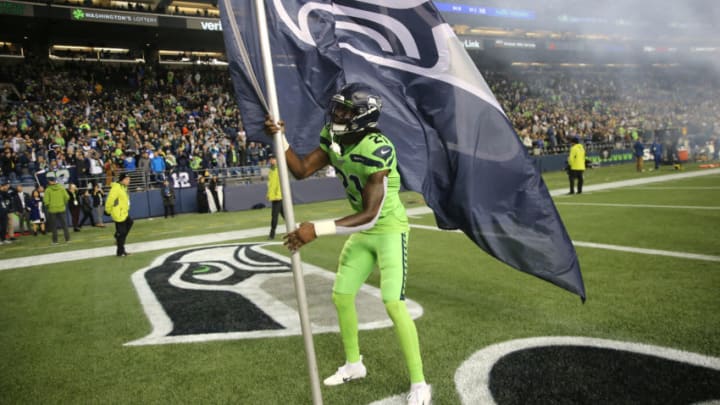 SEATTLE, WASHINGTON - OCTOBER 03: Tre Flowers #21 of the Seattle Seahawks celebrates on the field after the Seattle Seahawks defeated the Los Angeles Rams 30-29 during their game at CenturyLink Field on October 03, 2019 in Seattle, Washington. (Photo by Abbie Parr/Getty Images)