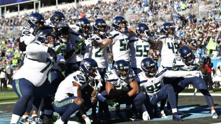 CHARLOTTE, NORTH CAROLINA - DECEMBER 15: Seattle Seahawks teammates celebrate after an interception by Seattle Seahawks middle linebacker Bobby Wagner #54 in the first half at Bank of America Stadium on December 15, 2019 in Charlotte, North Carolina. (Photo by Grant Halverson/Getty Images)