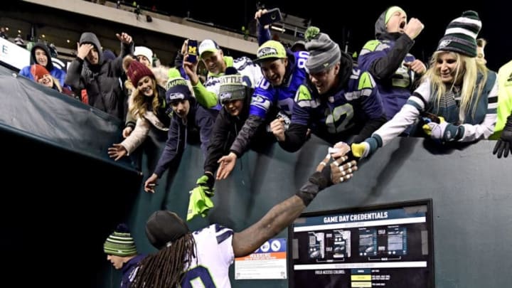 PHILADELPHIA, PENNSYLVANIA - JANUARY 05: Jadeveon Clowney #90 of the Seattle Seahawks celebrates victory with fans after his teams 17-9 win against the Philadelphia Eagles in the NFC Wild Card Playoff game at Lincoln Financial Field on January 05, 2020 in Philadelphia, Pennsylvania. (Photo by Steven Ryan/Getty Images)