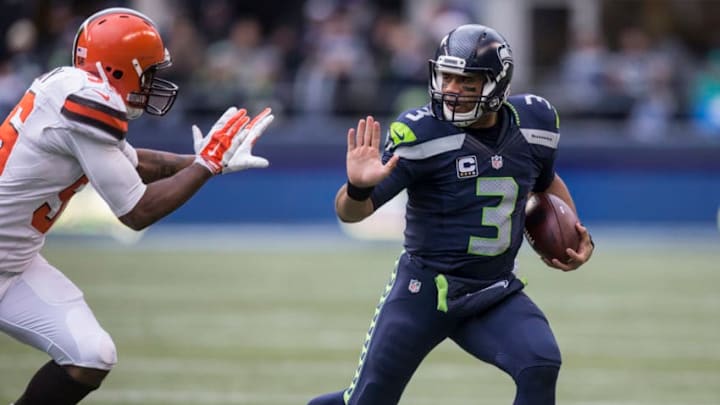 SEATTLE, WA - DECEMBER 20: Quarterback Russell Wilson #3 of the Seattle Seahawks runs with the ball during the first half of a football game against the Cleveland Browns at CenturyLink Field on December 20, 2015 in Seattle, Washington. The Seahawks won the game 30-13. (Photo by Stephen Brashear/Getty Images) SEATTLE, WA - DECEMBER 20: Quarterback Russell Wilson #3 of the Seattle Seahawks runs with the ball during the first half of a football game against the Cleveland Browns at CenturyLink Field on December 20, 2015 in Seattle, Washington. The Seahawks won the game 30-13. (Photo by Stephen Brashear/Getty Images)