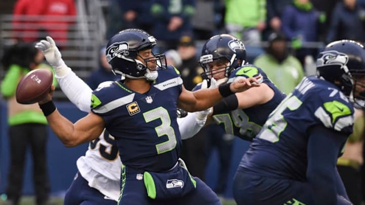 SEATTLE, WA - DECEMBER 17: Quarterback Russell Wilson #3 of the Seattle Seahawks passes against the Los Angeles Rams during the 2nd quarter of the game at CenturyLink Field on December 17, 2017 in Seattle, Washington. (Photo by Steve Dykes/Getty Images)