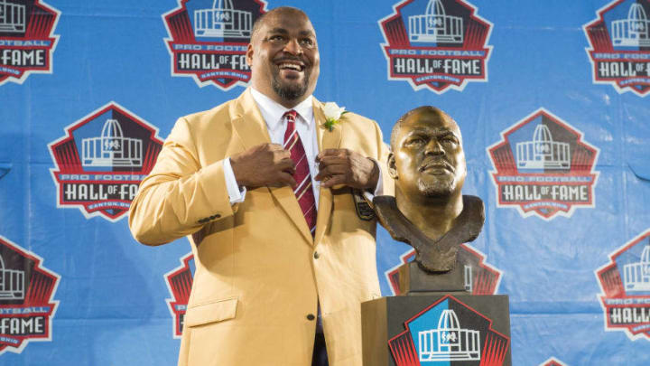 CANTON, OH - AUGUST 2: Former Seattle Seahawks tackle Walter Jones with his bust during the NFL Class of 2014 Pro Football Hall of Fame Enshrinement Ceremony at Fawcett Stadium on August 2, 2014 in Canton, Ohio. (Photo by Jason Miller/Getty Images)