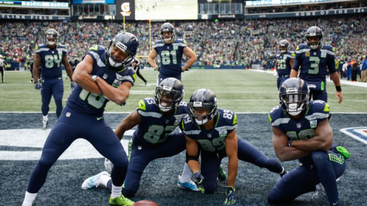 SEATTLE, WA - DECEMBER 02: Tyler Lockett #16 of the Seattle Seahawks celebrates a second quarter touchdown with teammates in the game against the San Francisco 49ers at CenturyLink Field on December 2, 2018 in Seattle, Washington. (Photo by Otto Greule Jr/Getty Images)