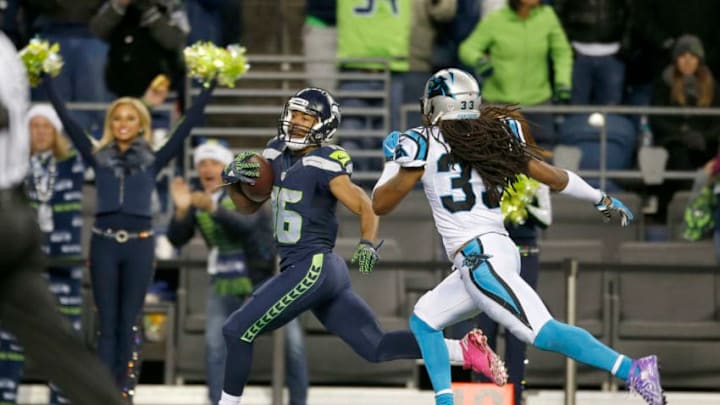SEATTLE, WA - DECEMBER 04: Wide receiver Tyler Lockett #16 of the Seattle Seahawks rushes for a touchdown against the Carolina Panthers at CenturyLink Field on December 4, 2016 in Seattle, Washington. (Photo by Otto Greule Jr/Getty Images) SEATTLE, WA - DECEMBER 04: Wide receiver Tyler Lockett #16 of the Seattle Seahawks rushes for a touchdown against the Carolina Panthers at CenturyLink Field on December 4, 2016 in Seattle, Washington. (Photo by Otto Greule Jr/Getty Images)