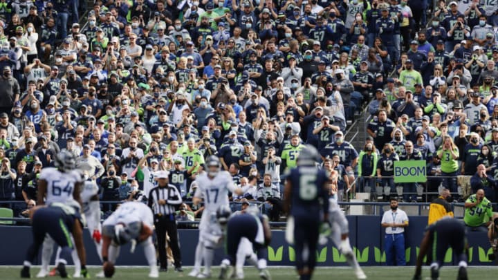 SEATTLE, WASHINGTON - SEPTEMBER 19: Fans cheer during the fourth quarter between the Seattle Seahawks and the Tennessee Titans at Lumen Field on September 19, 2021 in Seattle, Washington. (Photo by Steph Chambers/Getty Images)